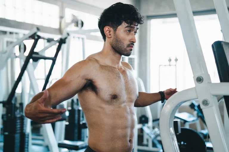 Man gradually returning to upper-body exercise after gynecomastia surgery.